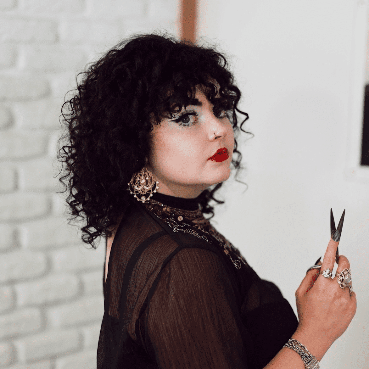 Portrait of Jessica Haughton, a professional stylist at Frequency Salon, showcasing their expertise and style.