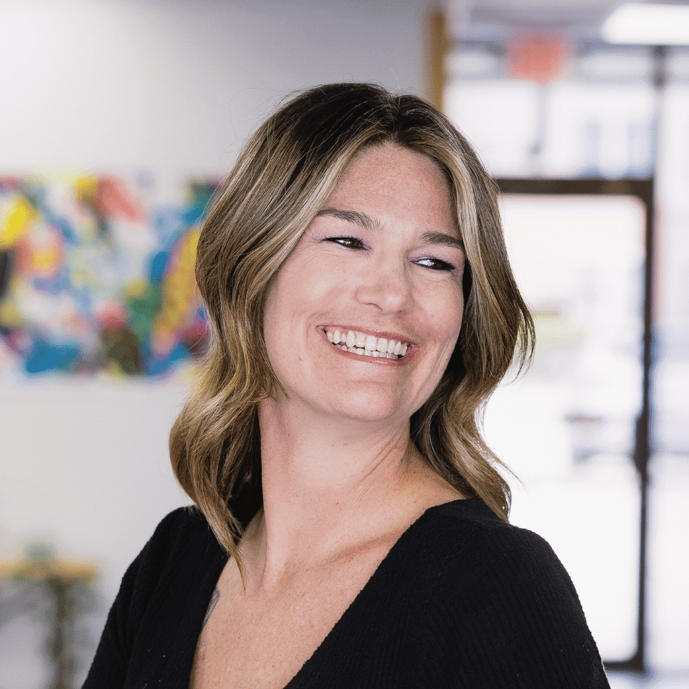 Portrait of Lindy Roberts, a professional stylist at Frequency Salon, showcasing their expertise and style.