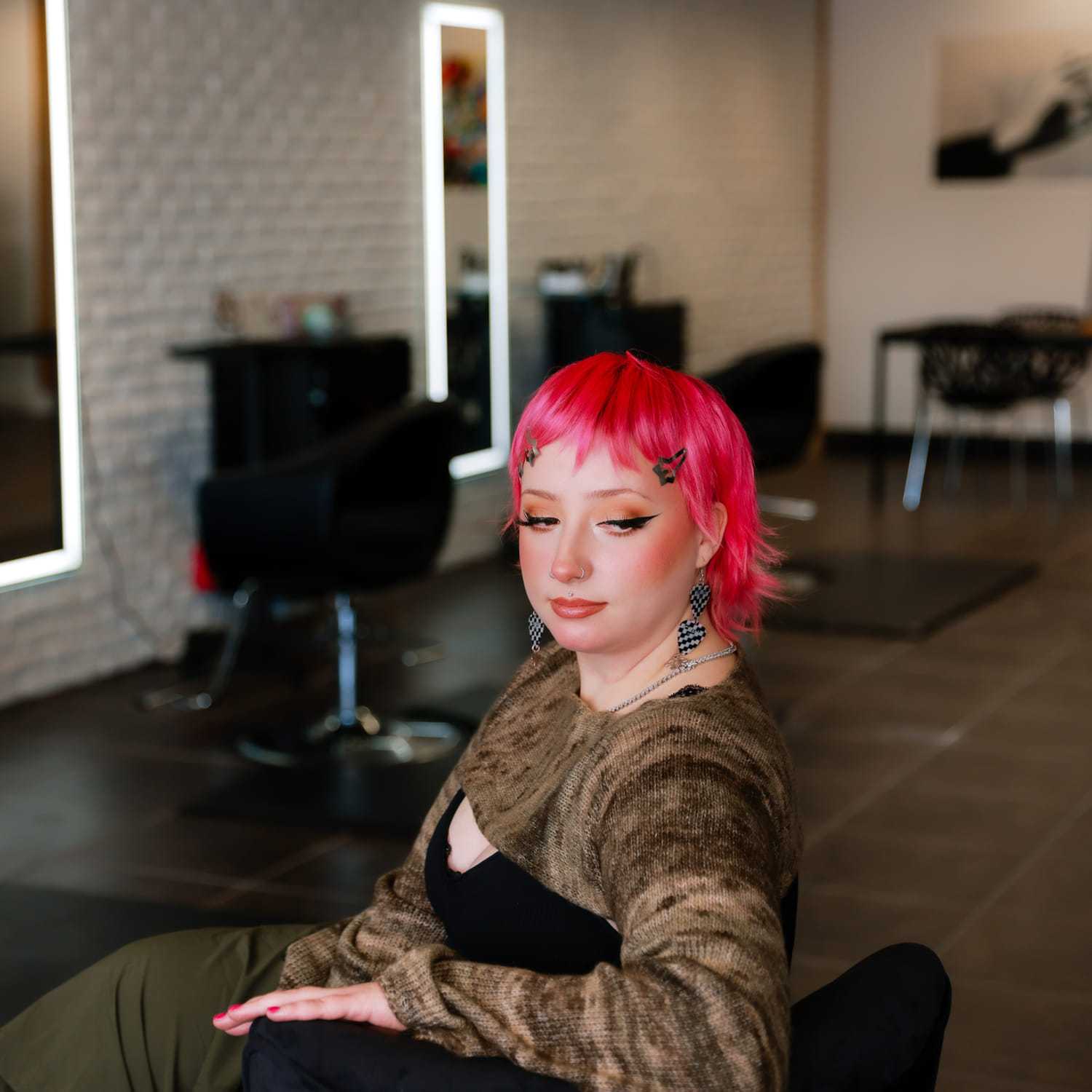 Portrait of Laramie Jane, a professional stylist at Frequency Salon, showcasing their expertise and style.