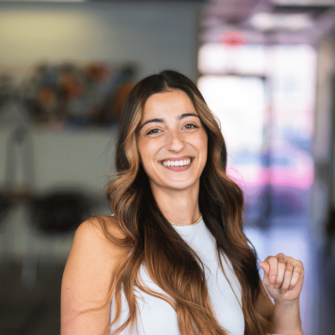 Portrait of Toni Solinas, a professional stylist at Frequency Salon, showcasing their expertise and style.