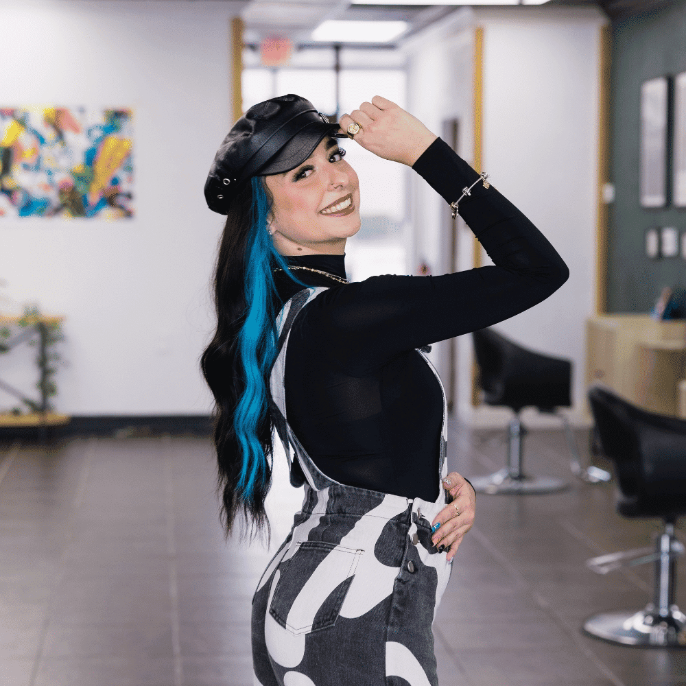 Portrait of Marisa Greenlaw, a professional stylist at Frequency Salon, showcasing their expertise and style.