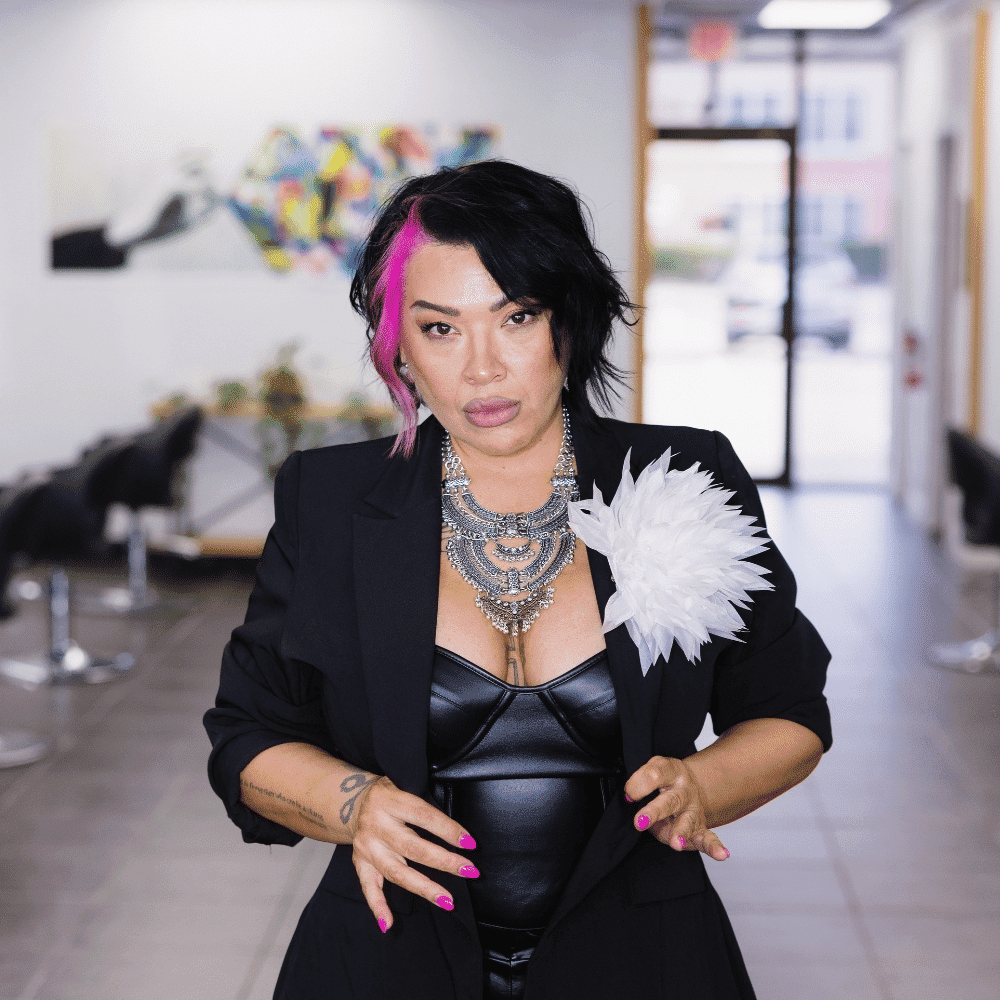 Portrait of Theresa Evans, a professional stylist at Frequency Salon, showcasing their expertise and style.