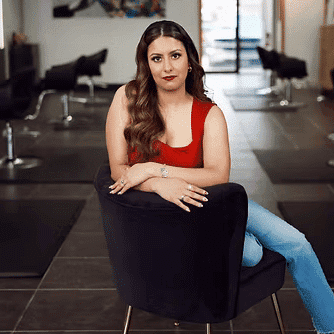 Portrait of Katia Palma, a professional stylist at Frequency Salon, showcasing their expertise and style.