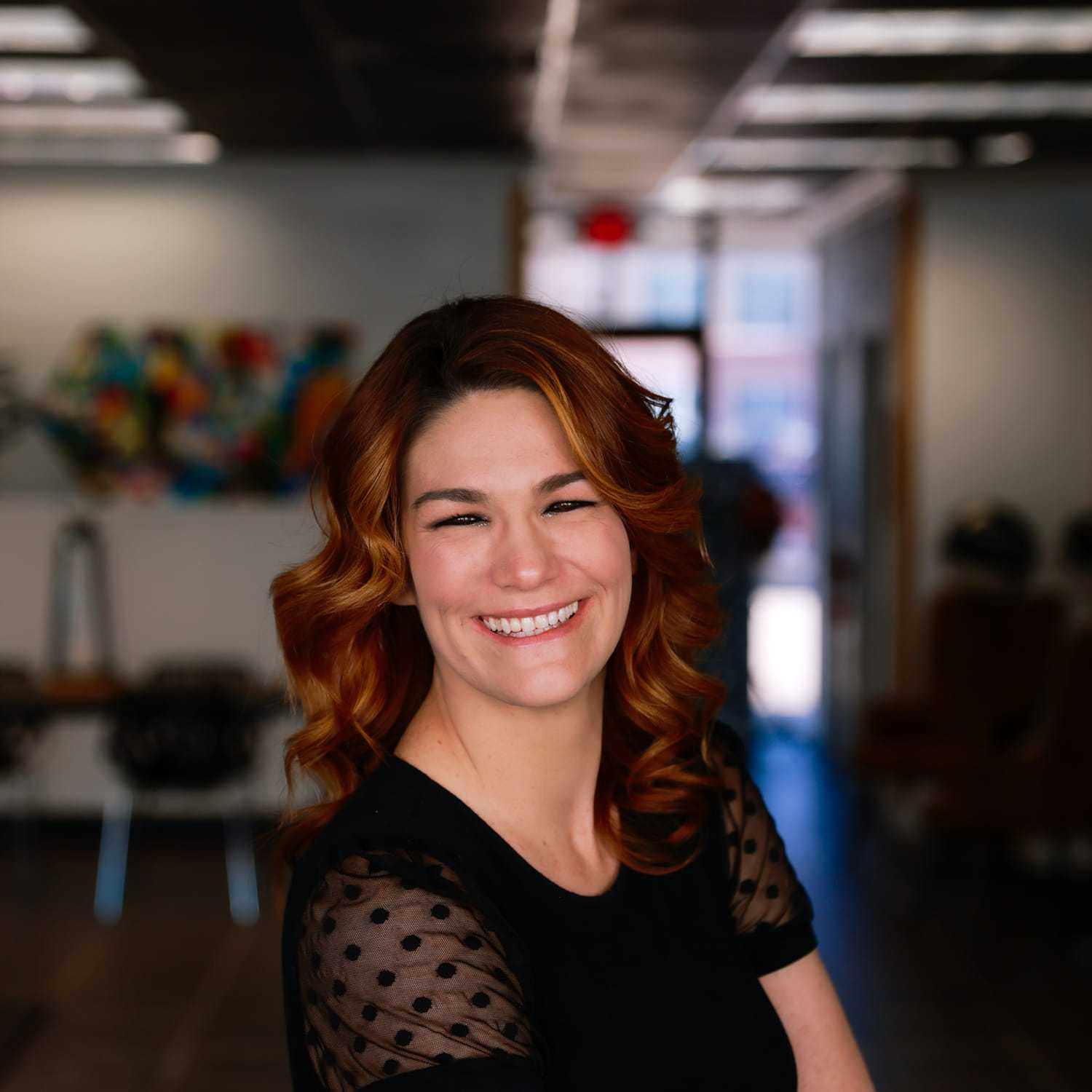 Portrait of Lindy Roberts, a professional stylist at Frequency Salon, showcasing their expertise and style.